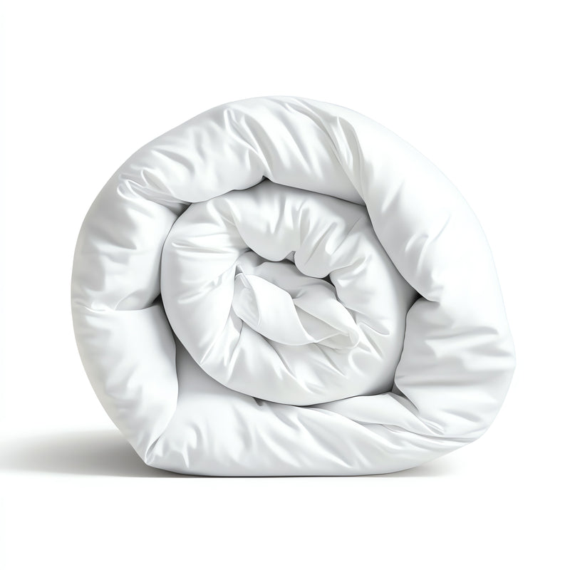 A rolled-up white microfibre all season duvet on a white background.