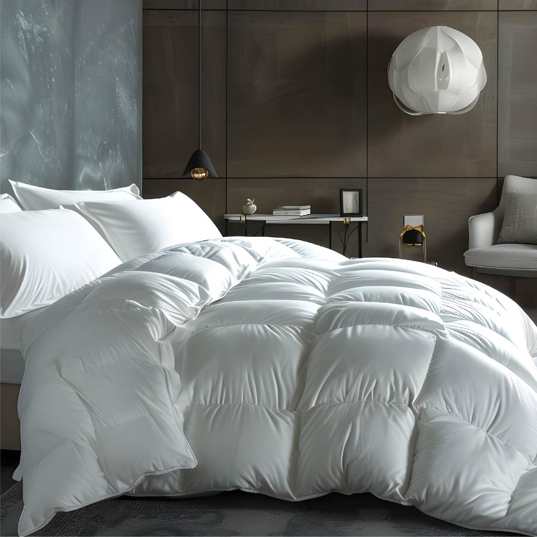 Elegant bedroom displaying a plush white duvet on a bed against a dark grey feature wall.