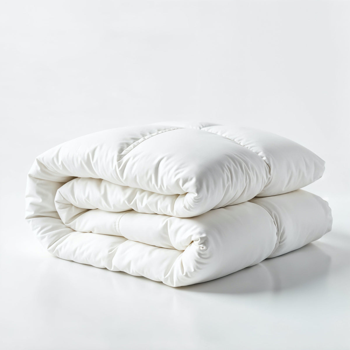 A folded white 4.5 tog cotton blend duvet displayed on a white background.