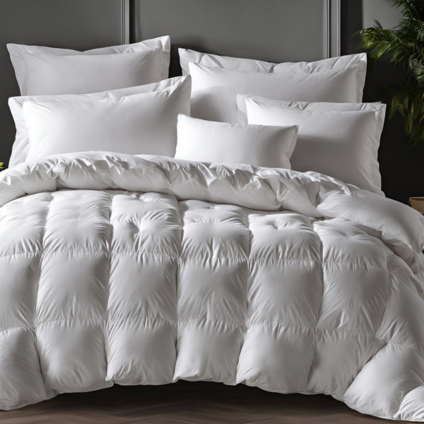 A set of white bedding including a down alternative duvet and pillows, presented in a tidy bedroom setup.
